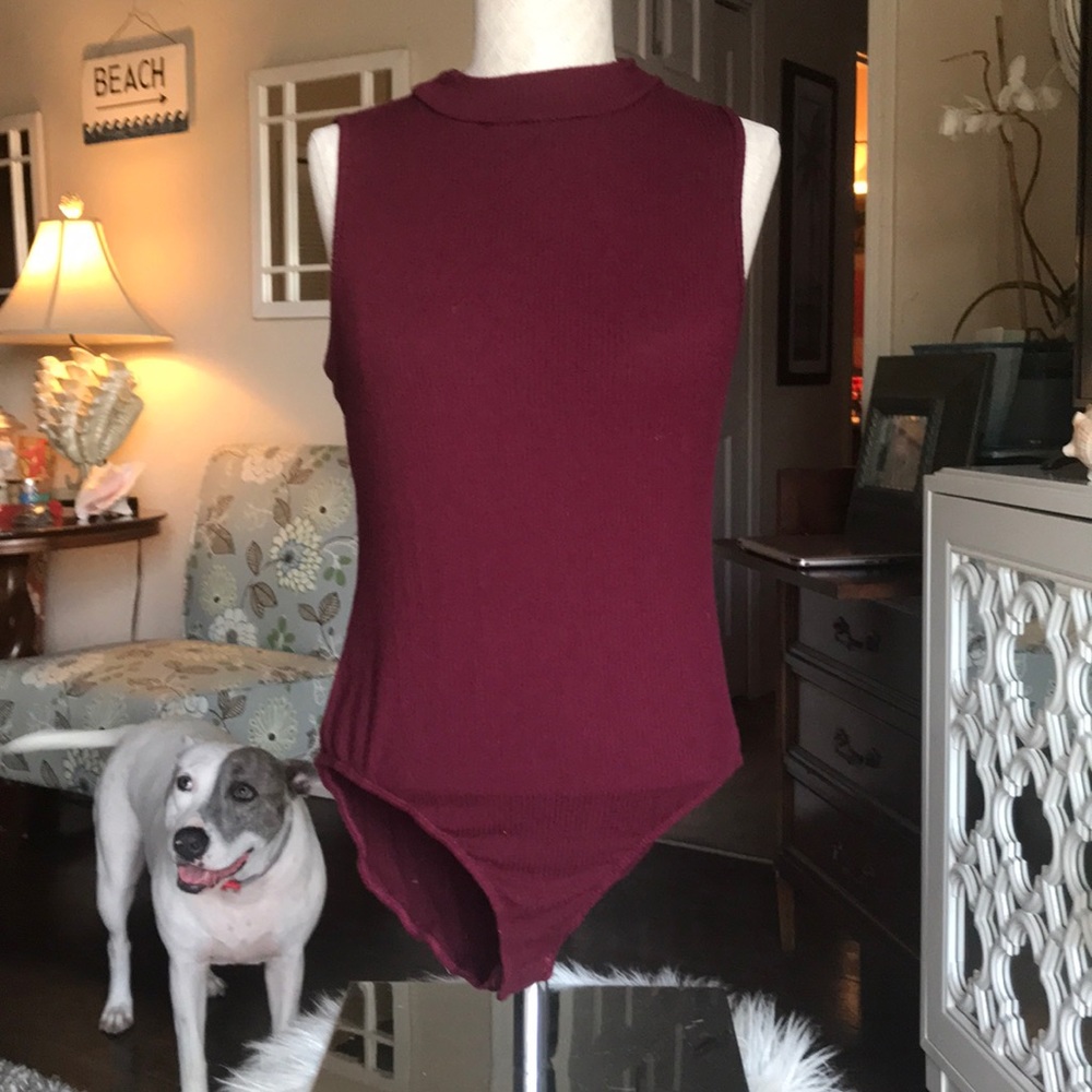 Women’s maroon ribbed body suit.